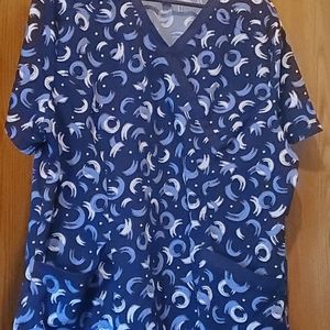 Plus size scrub top size XL. Tag doesn't say but feels like polyester andspandex